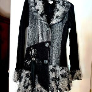 Sweater with long sleeves. Very warm. Has sequins on the bodice.